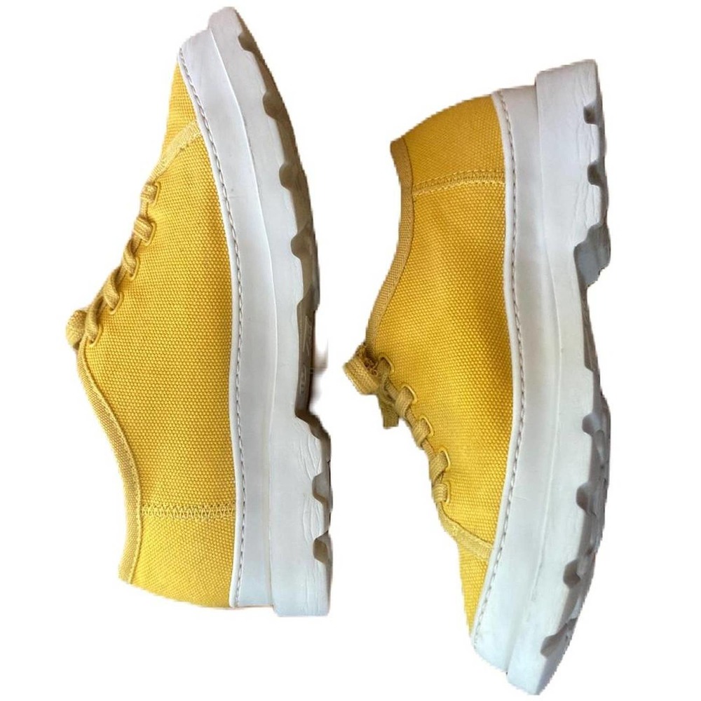 Bright yellow Camper brand platform tennis shoes